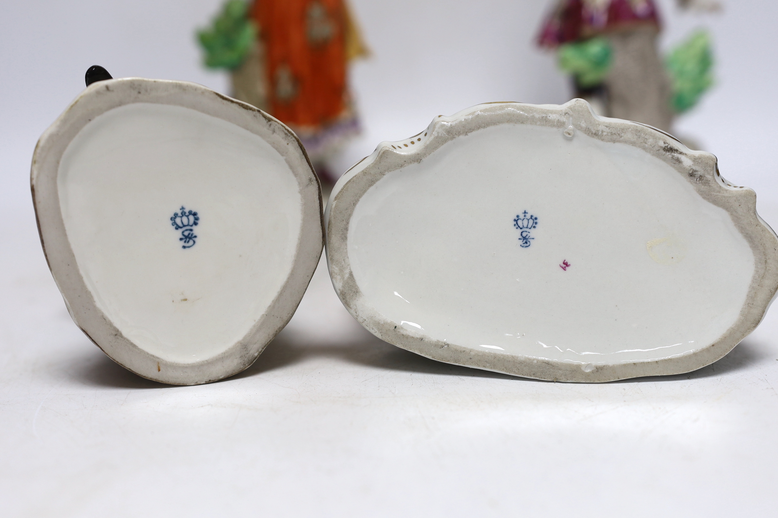 Four Sitzendorf porcelain figures in groups, early 20th century, 26cm